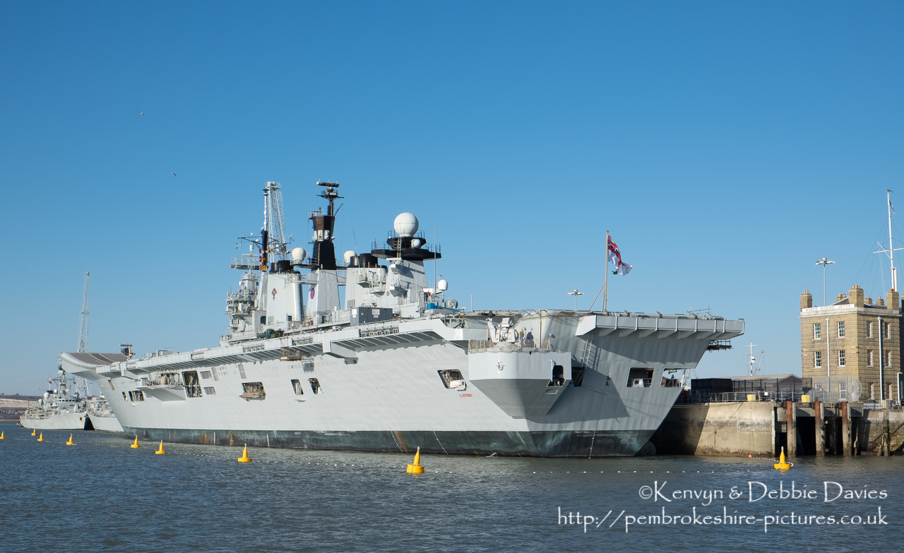 HMS Illustrious is an "Invincible" class light aircraft carrier, the middle of three built for the Royal Navy in the late 70s and early 80s (she was commissioned in 1982). Following the retirement of the Harrier VTOL aircraft in 2010 she became and helicopter carrier and is the oldest (as of 2014) serving ship in the Royal Navy. We were lucky to see her before her final deployment following which she will be de-commissioned and preserved for the nation.