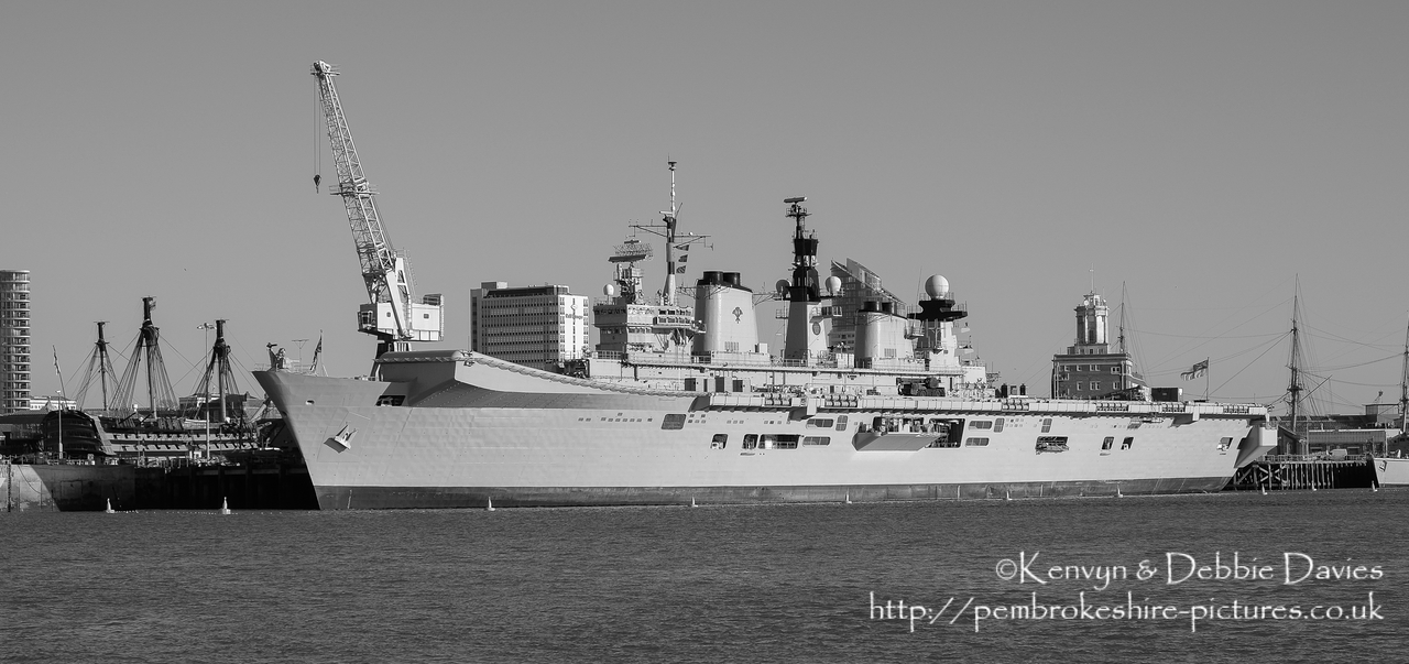 HMS Illustrious is an "Invincible" class light aircraft carrier, the middle of three built for the Royal Navy in the late 70s and early 80s (she was commissioned in 1982). Following the retirement of the Harrier VTOL aircraft in 2010 she became and helicopter carrier and is the oldest (as of 2014) serving ship in the Royal Navy. We were lucky to see her before her final deployment following which she will be de-commissioned and preserved for the nation.