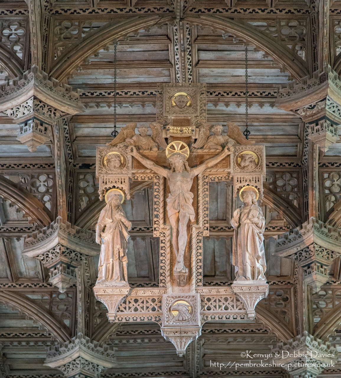 The ceiling of St Davids cathedral dates from the 16th century and is constructed in a secular type (appropriate for a great hall) with a Renaissance character. The crucifix is a 20th century replacement for the medieval original.